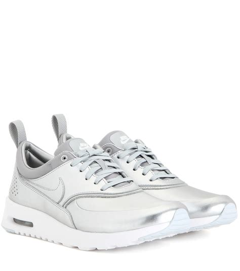 nike metallic silver sneakers.